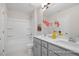 Bright bathroom featuring a double vanity with modern fixtures and a shower-tub combo at 428 Longleaf Glen Lane, Zebulon, NC 27597