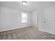 Bright bedroom with carpet, window, and a closet offering a comfortable living space at 428 Longleaf Glen Lane, Zebulon, NC 27597