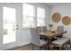 Bright dining room with modern table, chairs, bench, and stylish decor perfect for Gathering meals at 428 Longleaf Glen Lane, Zebulon, NC 27597