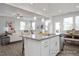 Bright, open-concept kitchen featuring a breakfast bar and stainless steel appliances at 428 Longleaf Glen Lane, Zebulon, NC 27597