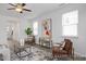 Bright living space features modern furniture, a decorative rug, and ample natural light at 428 Longleaf Glen Lane, Zebulon, NC 27597