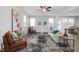 Bright living room boasts stylish furnishings, ample natural light, and modern decor at 428 Longleaf Glen Lane, Zebulon, NC 27597