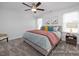 Comfortable main bedroom with stylish decor, soft carpet, and lots of natural light at 428 Longleaf Glen Lane, Zebulon, NC 27597