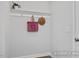 Mud room featuring hooks and a shelf; ideal for organizing coats and bags at 428 Longleaf Glen Lane, Zebulon, NC 27597