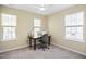 Bright room features a desk, chair, and two windows, creating an ideal workspace or study area at 4508 Cobble Creek Ln, Raleigh, NC 27616