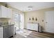 Bright kitchen with stainless steel dishwasher, granite countertops, and access to the backyard at 4508 Cobble Creek Ln, Raleigh, NC 27616
