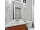 Cozy bathroom featuring a single sink, white toilet, light grey walls, and modern fixtures at 4812 Kaplan Dr, Raleigh, NC 27606