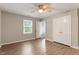 Bedroom featuring wood-look floors and double door closet for ample storage at 4812 Kaplan Dr, Raleigh, NC 27606