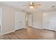 Spacious bedroom featuring wood-look floors and double closets on either side at 4812 Kaplan Dr, Raleigh, NC 27606
