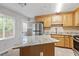 Bright kitchen featuring granite countertops, updated appliances, and plenty of natural light at 4812 Kaplan Dr, Raleigh, NC 27606