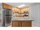 Functional kitchen with granite countertops, ample storage, and stainless steel refrigerator at 4812 Kaplan Dr, Raleigh, NC 27606