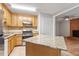 Spacious kitchen with granite countertops, ample cabinetry, and a stainless-steel fridge at 4812 Kaplan Dr, Raleigh, NC 27606