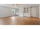 Bright living room with hardwood floors, a ceiling fan, built-ins, and natural light at 4812 Kaplan Dr, Raleigh, NC 27606