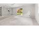 Finished basement featuring neutral carpet, a sliding glass door and built in shelving at 5001 Simpson Dr, Sanford, NC 27330