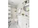 Bright, clean bathroom featuring a shower-tub combo, toilet, sink, and marble-look flooring with great lighting at 5001 Simpson Dr, Sanford, NC 27330