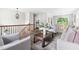 Open living space with wood floors, neutral paint, staircase, and view of dining area at 5001 Simpson Dr, Sanford, NC 27330