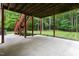 Covered patio with access to a grassy backyard, and stairs at 5001 Simpson Dr, Sanford, NC 27330