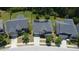 Aerial view of a home with solar panels and landscaped front yard on a suburban street at 5016 Trembath Ln, Cary, NC 27519