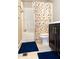 Standard bathroom with tile flooring, vanity, commode and a shower with a decorative curtain at 5016 Trembath Ln, Cary, NC 27519