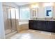 Bright bathroom features a shower, soaking tub, granite countertop, and a decorative privacy window at 5016 Trembath Ln, Cary, NC 27519