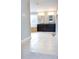 This bathroom boasts tile flooring, dark cabinets, and a large tub near the window at 5016 Trembath Ln, Cary, NC 27519