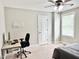 Bedroom with a light gray wall, a ceiling fan, and a desk provides a comfortable and functional space at 5016 Trembath Ln, Cary, NC 27519
