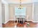 Cozy dining area with hardwood floors and a modern chandelier at 5016 Trembath Ln, Cary, NC 27519