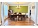 Formal dining room with hardwood floors, decorative molding, and elegant chandelier at 5016 Trembath Ln, Cary, NC 27519