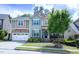 Charming two-story home with a well manicured lawn and beautiful curb appeal at 5016 Trembath Ln, Cary, NC 27519