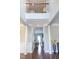 Grand foyer with hardwood floors, high ceilings, and elegant architectural details at 5016 Trembath Ln, Cary, NC 27519