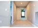 The hallway is carpeted and has a view into an adjacent room at 5016 Trembath Ln, Cary, NC 27519