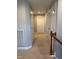 A carpeted hallway with white doors and light gray walls connects different areas of the home at 5016 Trembath Ln, Cary, NC 27519