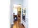 Well-designed kitchen with stainless steel appliances, hardwood flooring, and double ovens offer ample cooking and dining options at 5016 Trembath Ln, Cary, NC 27519