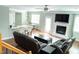 Spacious living room with hardwood floors, fireplace, and modern furniture provides a comfortable living space at 5016 Trembath Ln, Cary, NC 27519