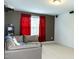 Finished basement with a gray couch, large window and a movie projector on the ceiling at 5016 Trembath Ln, Cary, NC 27519
