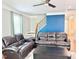 Comfortable living room with plush seating, hardwood floors, and a ceiling fan at 5016 Trembath Ln, Cary, NC 27519