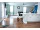 Open-concept layout connecting the kitchen to a cozy living room with a fireplace, hardwood floors, and natural light at 5016 Trembath Ln, Cary, NC 27519