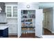 Spacious pantry with organized shelving, conveniently located near the kitchen with modern appliances and white cabinetry at 5016 Trembath Ln, Cary, NC 27519
