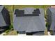 Aerial view of a roof with solar panels on a sunny day surrounded by lush, green lawns and neighboring homes at 5016 Trembath Ln, Cary, NC 27519