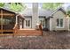 Back exterior of the home featuring a wood deck and stairs at 5609 Barham Ct, Raleigh, NC 27613