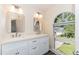 Bright bathroom with a double vanity, natural light, and modern fixtures at 5609 Barham Ct, Raleigh, NC 27613