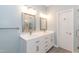 Bright bathroom featuring a double vanity with modern fixtures and a walk-in shower at 5609 Barham Ct, Raleigh, NC 27613