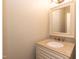 Powder room with granite countertop and single vanity at 5609 Barham Ct, Raleigh, NC 27613