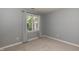 Bedroom featuring neutral decor and a large window at 5609 Barham Ct, Raleigh, NC 27613