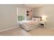 Cozy bedroom with natural light and neutral decor at 5609 Barham Ct, Raleigh, NC 27613
