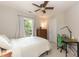 Bedroom with natural light, desk, and ceiling fan at 5609 Barham Ct, Raleigh, NC 27613