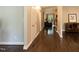Inviting hallway with hardwood floors and neutral paint that leads to a bright living space at 5609 Barham Ct, Raleigh, NC 27613