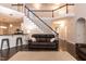Large living room showing stairs to upper level, open to kitchen, and a comfortable seating area at 5609 Barham Ct, Raleigh, NC 27613
