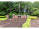 Harrington Grove neighborhood entrance sign with manicured landscaping at 5609 Barham Ct, Raleigh, NC 27613