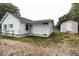 Exterior view of home showing a backyard with shed and fencing at 6 1St St, Franklinton, NC 27525